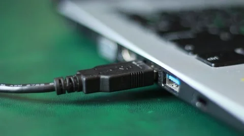 Somebody pulling a USB-cable out from a computer Stock Footage 64622797