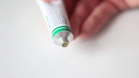 Somebody squeezing out an ointment Stock Footage 71071308
