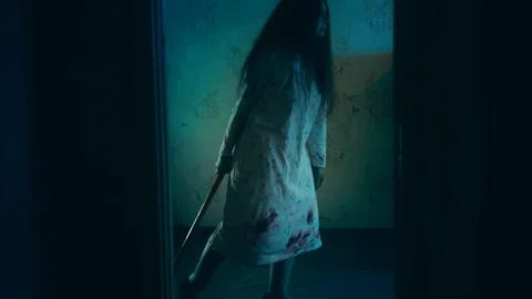 Somebody watching crazy witch pulling sledgehammer in a haunted castle room Stock Footage 260069129