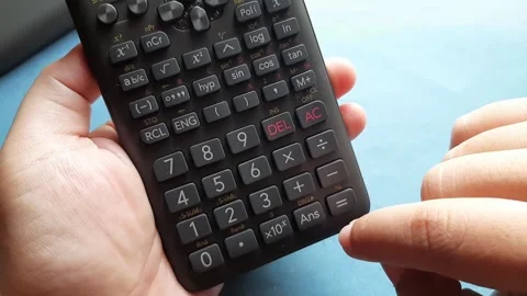 Someone calculates using a calculator	 Stock Footage 285910863