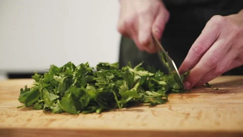 Someone is chopping parsley. Stock Footage 146823088