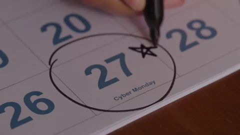Someone Circles and Writes a Star on Cyber Monday on a Calendar with a Sharpie Stock Footage 270290404