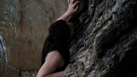 Someone climbing down cliff side Stock Footage 83164043