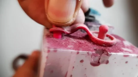 Someone closes a dirty printer ink tank. 4k macro footage Stock-Footage 290509318