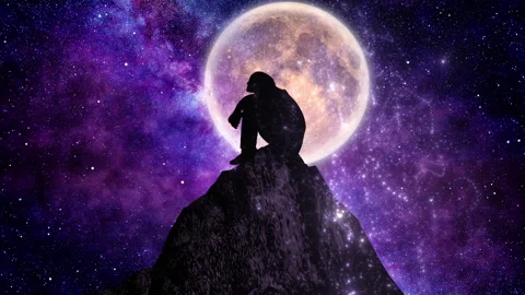 Someone is contemplating on a hill with a full moon in the background Video stock 290868752