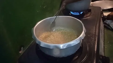 Someone is cooking Indomie in the kitchen, a typical Indonesian food. Stock Footage 304337569