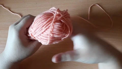 Someone crocheting starts making a magic ring Stock Footage 296612621