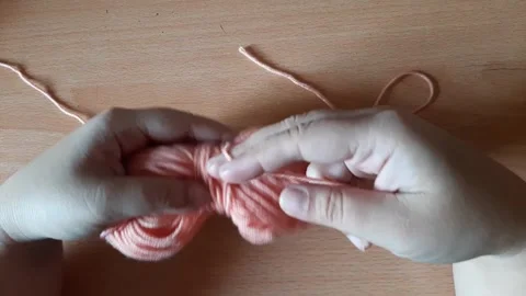 Someone crocheting starts making a magic ring Stock Footage 296612653