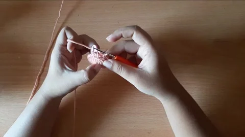 Someone crocheting starts making a magic ring Stock Footage 296612805