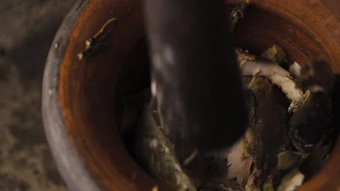 Someone crushing fish meat with mortar and pestle. Prepare to make a fish paste Stock Footage 147065945