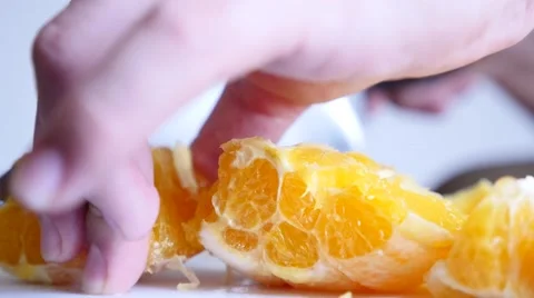 Someone cutting an orange Stock Footage 50357394