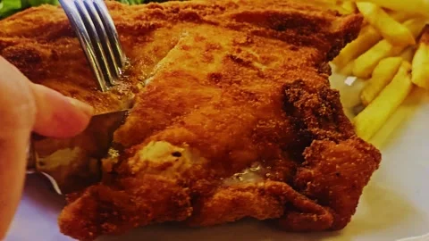 Someone is cutting into a piece chicken. Stock-Footage 284068425