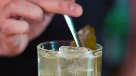 Someone is decorating the cocktail. Stock Footage 130851558