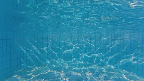 Someone diving into swimming pool at the background of waves texture Stock Footage 107417248