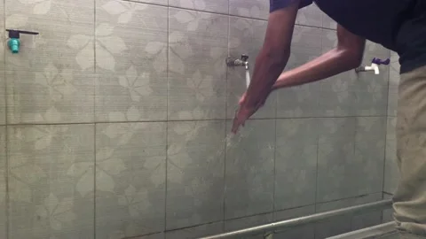 Someone is doing ablution before praying Stock Footage 168874632