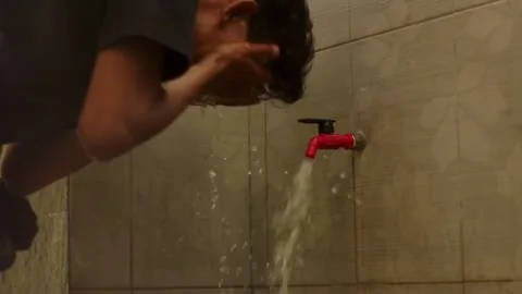 Someone is doing ablution before praying. Stock Footage 247968198
