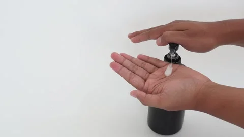 Someone is dripping soap liquid onto their palms. Stock Footage 337690265