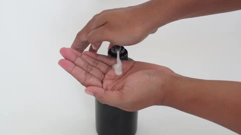 Someone is dripping soap liquid onto their palms. Stock Footage 337690270