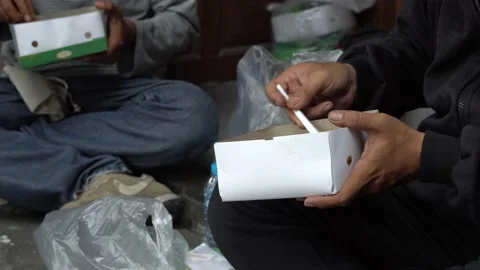 Someone is eating with a box packaging Stock Footage 208922325