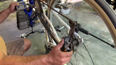 Someone fixing a bicycle with a broken wheel Stock Footage 168922330