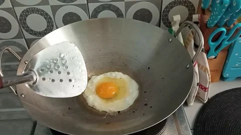 Someone fried a sunny side up for lunch Stock Footage 153580802