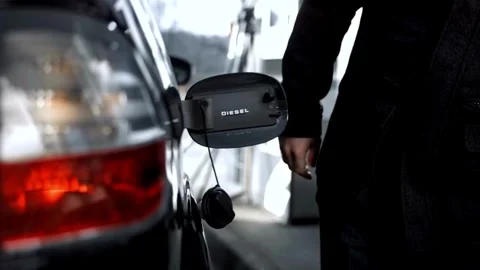 Someone hand holding nozzle for refueling car from gas station or petrol 库存影片 336569743