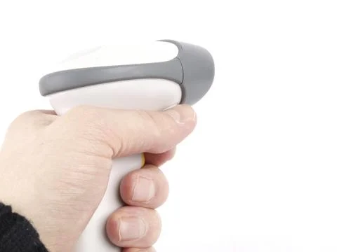 Someone holding a bar-code scanner, pointing towards right from left, towards Photos