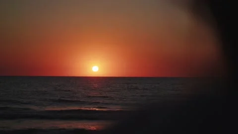 Someone looking at sunset Stockbeeldmateriaal 237758348