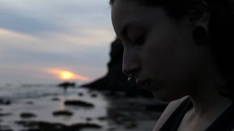 Someone looking through a pile of collected shells Stock Footage 83248885