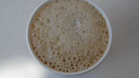 Someone makes instant coffee. close up top view. Видео 115912572