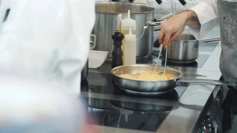 Someone making pasta in the kitchen. Stock Footage 113852540