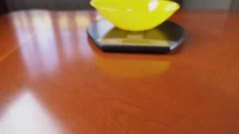 Someone measures cottage cheese in electronic form in the kitchen. 4k, slow Stock Footage 83834687