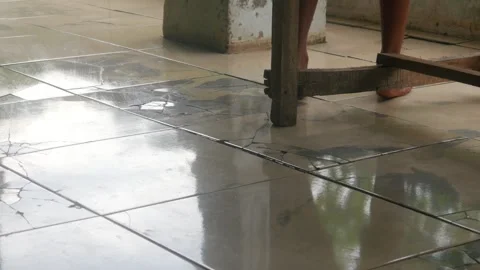 Someone is mopping the dirty ceramic Stock Footage 327190246