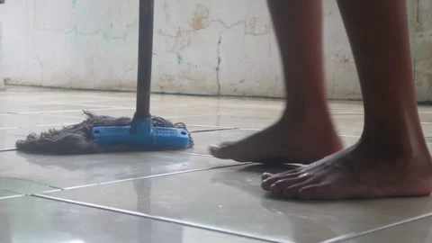 Someone is mopping the dirty ceramic Stock Footage 327190275