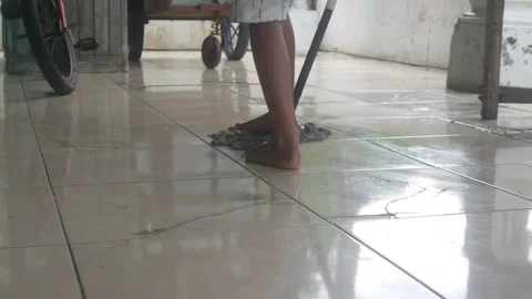 Someone is mopping the dirty ceramic Stock Footage 327190416
