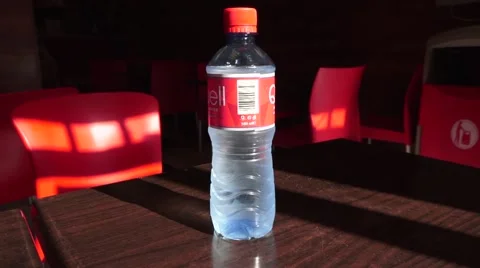 Someone picking up a bottle of water Video stock 53991249