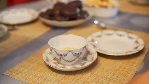 Someone Pours Tea into a Cup Stock Footage 100278554