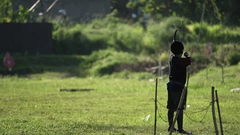 Someone is practicing archery in slow motion Stock Footage 258642252