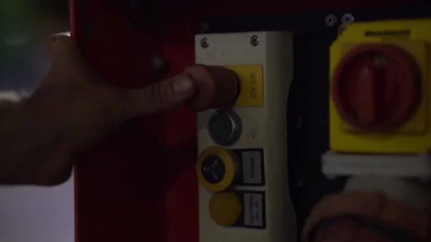 Someone presses an emergency stop button at night Stock Footage 203855858