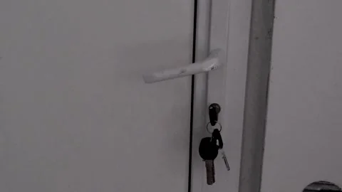 Someone is pulling the door handle, trying to break the door. Concept of robbery Stock Footage 265899762