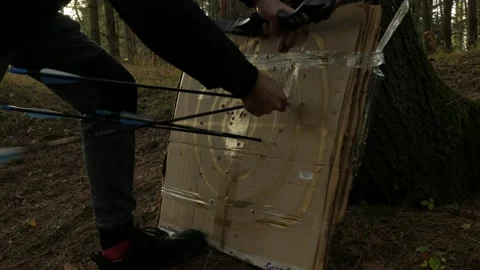 Someone pulls out arrows with a bow in their hands 스톡 동영상 220906387