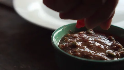 Someone put chilli on top of a chili paste. Thai food. Thai menu. nam prick Stock Footage 127127632