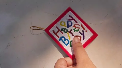 Someone put down a birthday card Vidéo 313460534