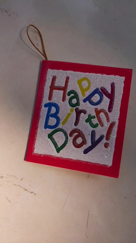 Someone put down a birthday card Stock Footage 313460535