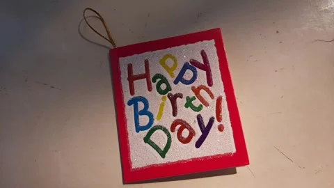 Someone put down a birthday card Stock Footage 313460548