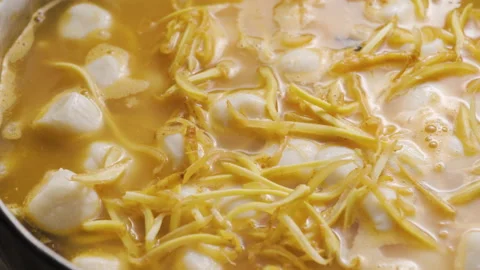 Someone put ginger in a pot full of meat ingredient.  Video stock 147122383