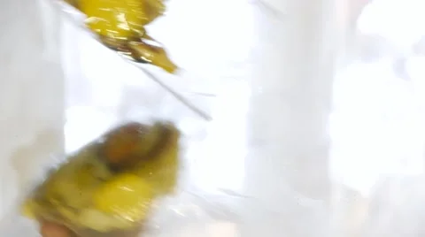 Someone puts dried fruit apple on a mirror table, close-up Stock Footage