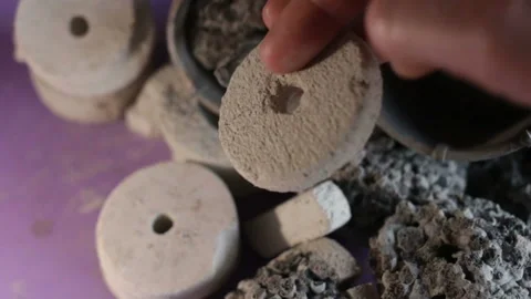 Someone puts a gas-silicate drill sample in the crown for drilling hard rocks of Stock Footage 128829248