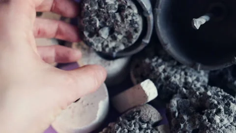 Someone puts a multi-layer drill sample in the crown for drilling hard rocks of Stock Footage 128829121