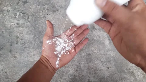 Someone puts powder on her hand Video stock 246865771